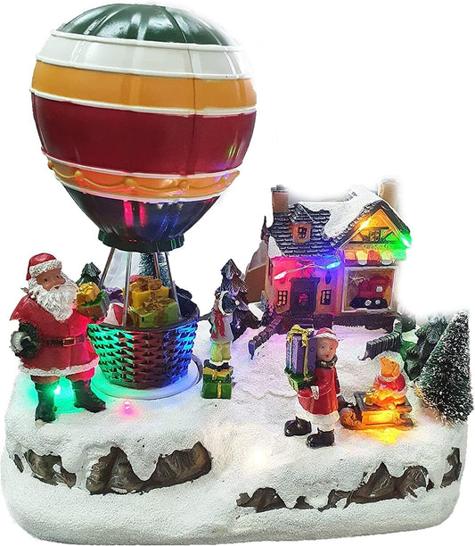 VILLAGGIO NATALIZIO CON MONGOLFIERA GIREVOLE, LUCI LED COLORATE E MUSICHE